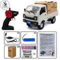 Remote Control Suzuki Rechargeable With Spray Smoke – Headlights & Sound Functions – 1:16 Scale Pickup & Delivery Truck – Random Color. 