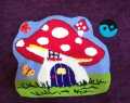 Whimsical Mushroom Cottage measuring 43 x 38 cm punch needle wall hanging. 