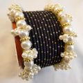 Trendy metal bangles set with pearl bangles golden dotted pearl bangles set bangles for girls in all sizes and colors. 