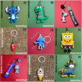 Cartoon character / action figure rubber keychain for kids (girls and boys) - Stitch, Dinosaur, Sponge bob, Spoofy, Doremon, Chilli, Cow, Bear cone. 
