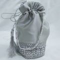 traditional potli gol bag clutch with silver lace. 