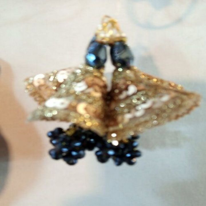 Ø§Ù†ÚˆÛŒÙ† Ú¯ÙˆÙ„ÚˆÙ† Ù¹ÛŒØ³Ù„ Ù†ÛŒÙˆÛŒ Ù†ÛŒÙ„Û’ Ø±Ù†Ú¯ Ú©Û’ Ú©Ø±Ø³Ù¹Ù„ Ù…ÙˆØªÛŒÙˆÚº Ú©Û’ Ø³Ø§ØªÚ¾ ÙØ±ÙˆØ®Øª Ú©Û’ Ù„Ø¦Û’ Ø¨ÛØª Ù…Ù†Ø§Ø³Ø¨ Ù‚ÛŒÙ…Øª Ù…ÛŒÚº