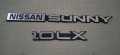 Nissan Sunny 1.OLX 2 Piece Emblem Set. 